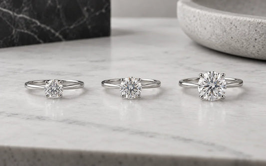 Three round moissanite rings showing increasing center stone sizes